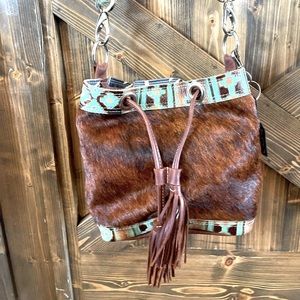 Holy cow couture mini feed bucket purse. Very good condition and barely used.